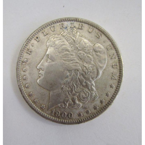 444 - United States 1900 Morgan Dollar, very fine, with two Kennedy Half Dollars 1967 & 1968