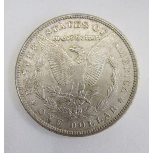 444 - United States 1900 Morgan Dollar, very fine, with two Kennedy Half Dollars 1967 & 1968