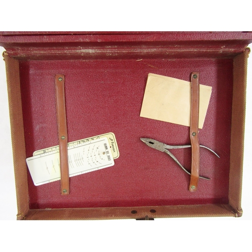 181 - Canvas and leather carrying case containing various fishing accessories including salmon scales, qua... 