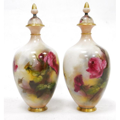 88 - Pair of early 20th century Royal Worcester Hadley Ware oviform vases and covers, printed green marks... 