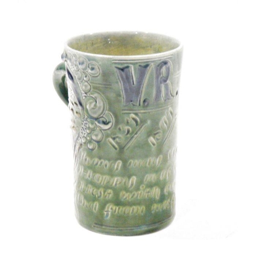 99 - A CH Brannam Art Pottery Victorian Jubilee green-glazed mug, incised CH Brannam/Barum, TB, dated 189... 