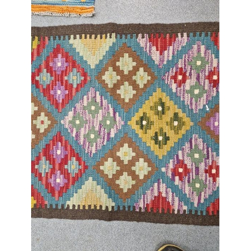 1031 - Blue ground Maimana kilim runner with one central row of nine lozenge floral medallions flanked by t... 