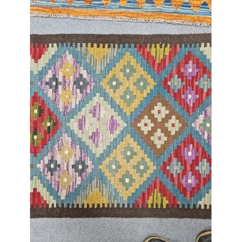 1031 - Blue ground Maimana kilim runner with one central row of nine lozenge floral medallions flanked by t... 