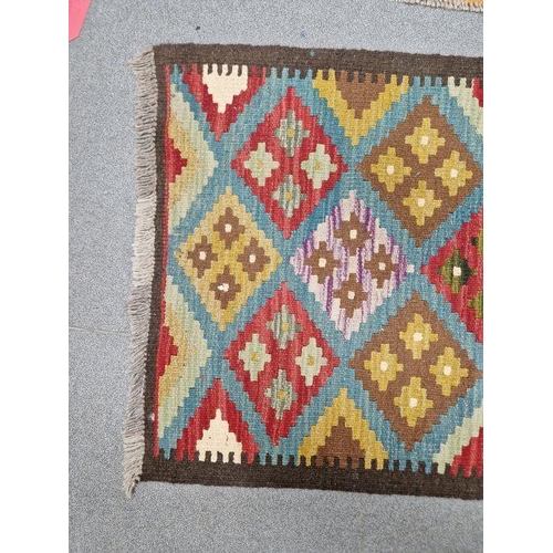 1031 - Blue ground Maimana kilim runner with one central row of nine lozenge floral medallions flanked by t... 