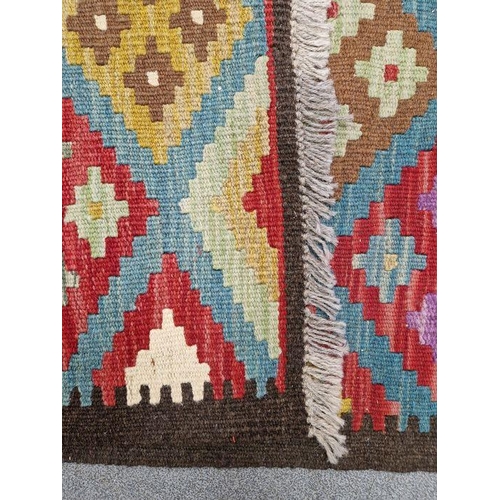 1031 - Blue ground Maimana kilim runner with one central row of nine lozenge floral medallions flanked by t... 