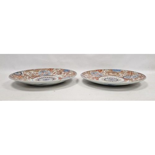 221 - A pair of Japanese Meiji period (1868-1912) imari chargers, printed, painted and gilt with a central... 