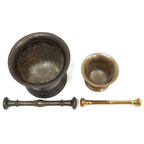 232 - Cast metal mortar and pestle, the mortar 14cm high with flared rim and a small copper-coloured morta... 