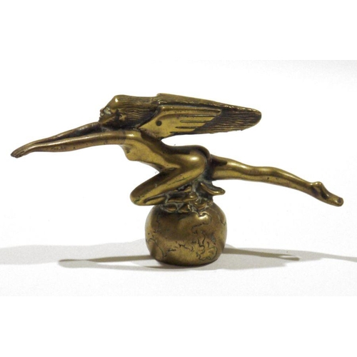 309 - Cast brass winged female nude figure as a car mascot, in Art Deco-style, 17cm long, an embossed crea... 