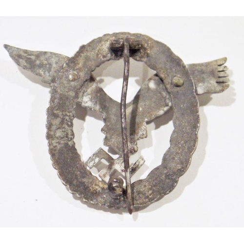 311A - German cast metal badge in the form of a Second World War luftwaffe pilots badge, unmarked