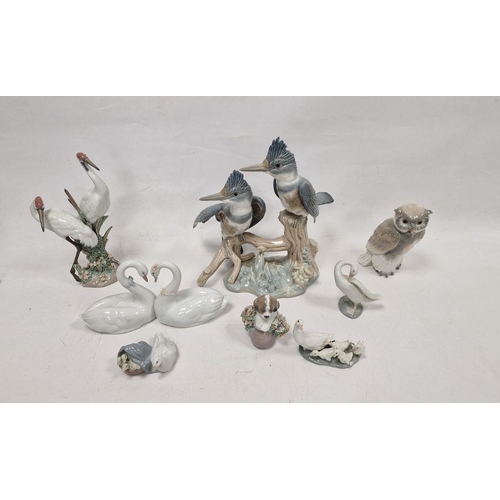 35 - Group of eight Lladro and Nao figures, printed and impressed marks, including: a pair of swans in he... 