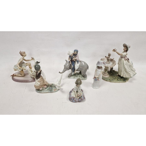 38 - Six Lladro figures, printed and impressed marks, including: an Eastern couple riding an elephant, a ... 