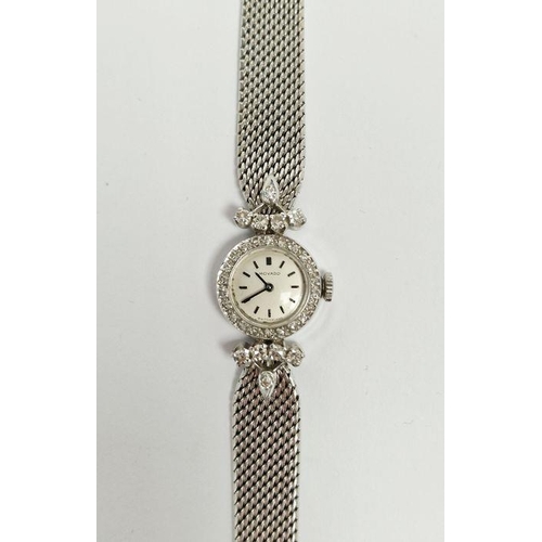 530 - Mid-century lady's 9ct white gold and diamond set Movado cocktail wristwatch, the circular dial havi... 