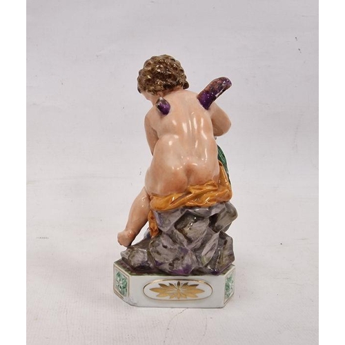 56 - Meissen (Marcolini) figure of Cupid atop rockwork, circa 1800, blue crossed swords, star and I mark,... 