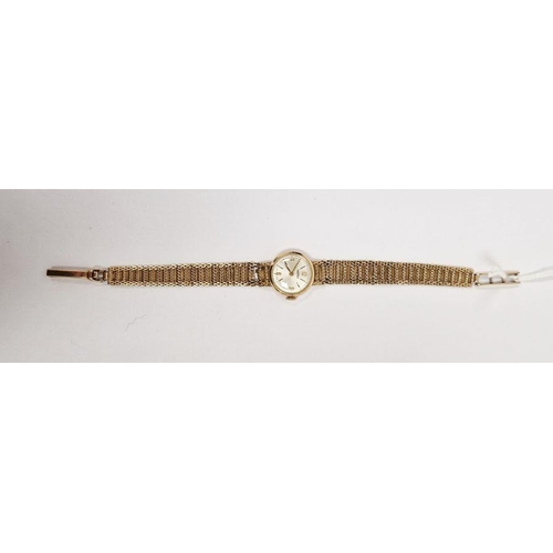 603 - Lady’s 9ct gold Roamer wristwatch with circular dial, baton numerals and the flexible mesh 9ct gold ... 