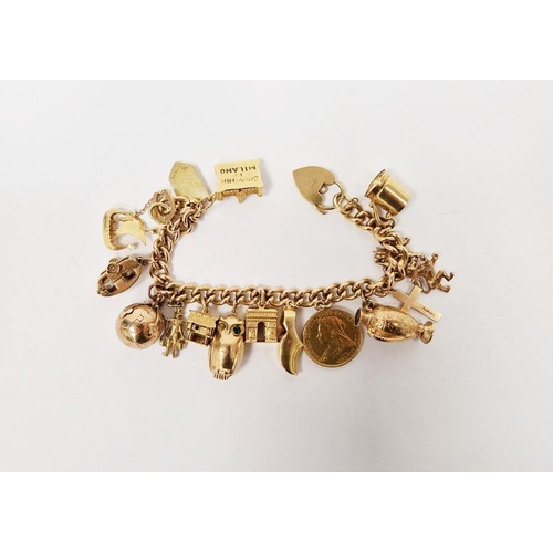 630 - 9ct gold charm bracelet with Victorian 1894 sovereign, various gold charms to include folding Masoni... 