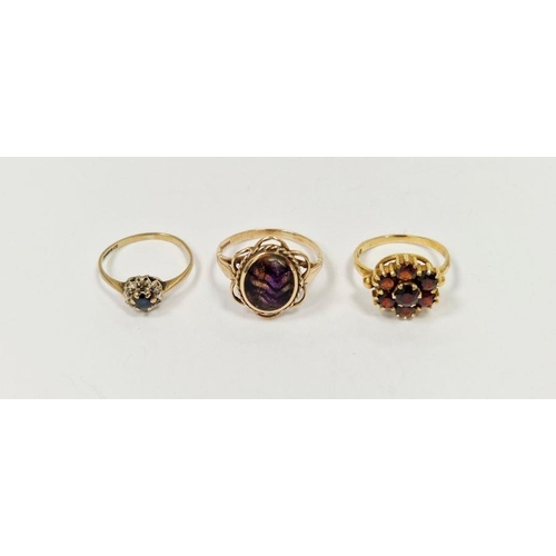 666 - 9ct gold and garnet cluster dress ring, a 9ct gold and bluejohn oval ring and a 9ct gold, sapphire a... 