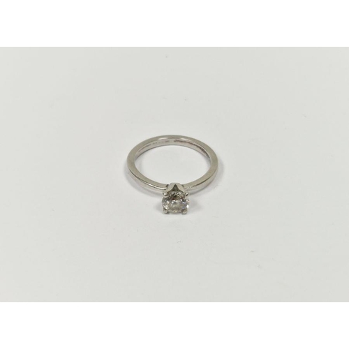 703 - Platinum and solitaire diamond ring, the claw set stone 0.65ct approx.