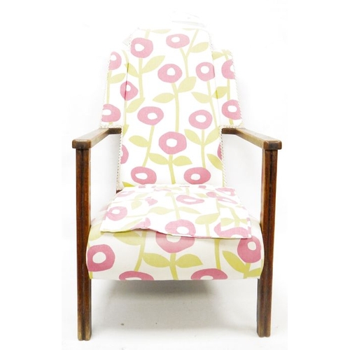 1056a - Mid twentieth century wingback oak framed armchair, upholstered in stylised poppy fabric, rush seate... 