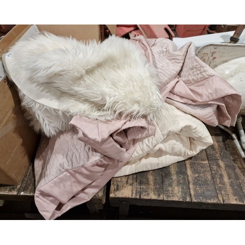 Two Cozee Home faux fur pelt rugs a Kelly Hoppen blanket and a