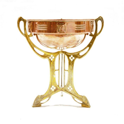 104 - Art Nouveau copper centrepiece bowl on brass stand, circa 1900, the bowl with a band of pierced foli... 