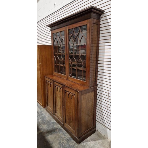 1054 - Victorian mahogany Gothic Revival-style library bookcase, having a moulded cornice over a pair of ba... 