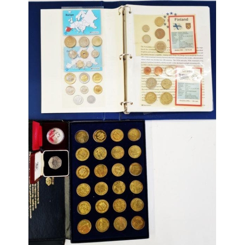 182 - Collection of 23 tokens representing the XXIIIrd Olympiad Los Angeles 1984, some damage to the inner... 