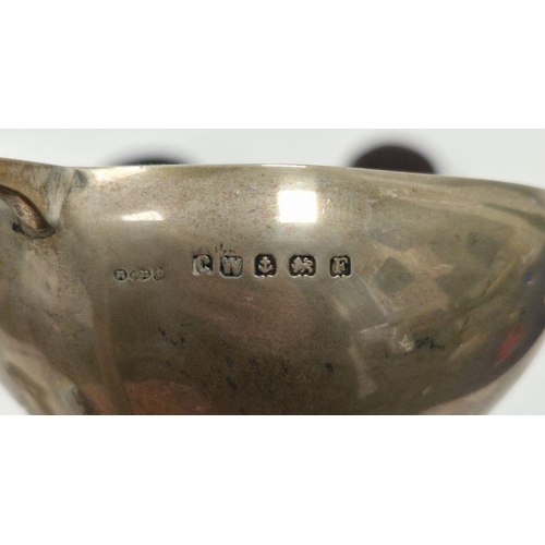 329 - Four early 20th century unengraved silver trophies, each being twin-handled and raised on pedestal, ... 