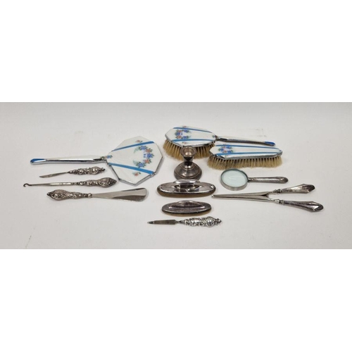 330 - Hallmarked silver squat candlestick, 6cm high, a selection of silver-handled dressing items includin... 