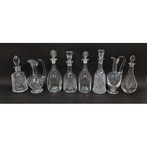 59 - Collection of decanters and claret jugs including a St Louis claret jug, a pair of kicked-in style w... 