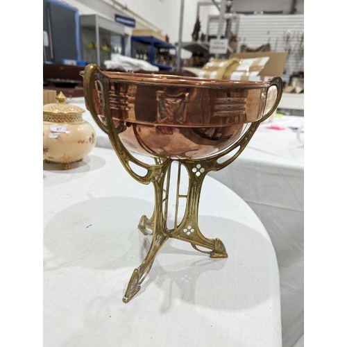 104 - Art Nouveau copper centrepiece bowl on brass stand, circa 1900, the bowl with a band of pierced foli... 