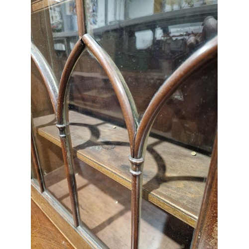 1054 - Victorian mahogany Gothic Revival-style library bookcase, having a moulded cornice over a pair of ba... 