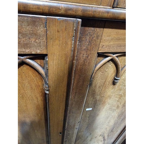 1054 - Victorian mahogany Gothic Revival-style library bookcase, having a moulded cornice over a pair of ba... 