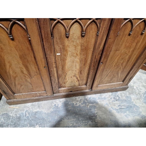 1054 - Victorian mahogany Gothic Revival-style library bookcase, having a moulded cornice over a pair of ba... 