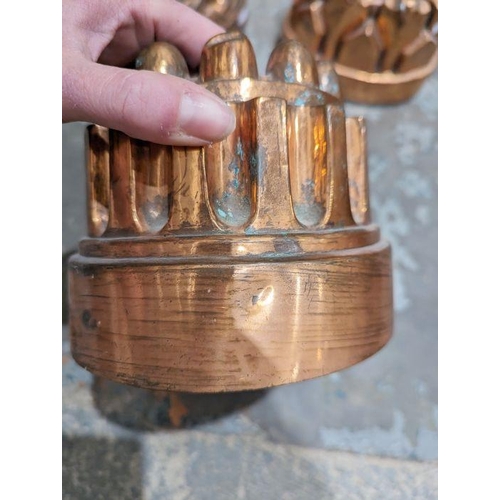 121 - Collection of late 19th/early 20th century copper jelly moulds including three marked for Colley abo... 