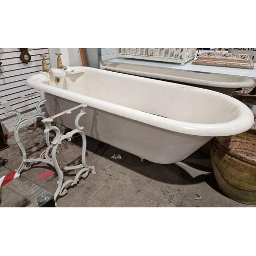 1248 - Vintage cast iron roll-top bath . 208 cms long, with brass taps and integral soap dishes and a cast ... 