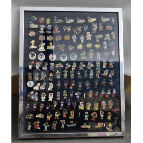 132A - Approximately 120 Robertsons Golly badges, mounted and framed 

These items are listed on the basis ... 