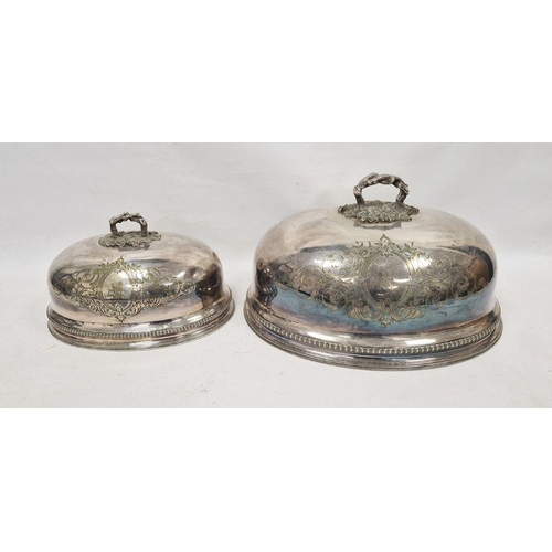 274 - Two graduated 19th century silver-plated meat domes, each having scrolling engraved foliate motifs t... 