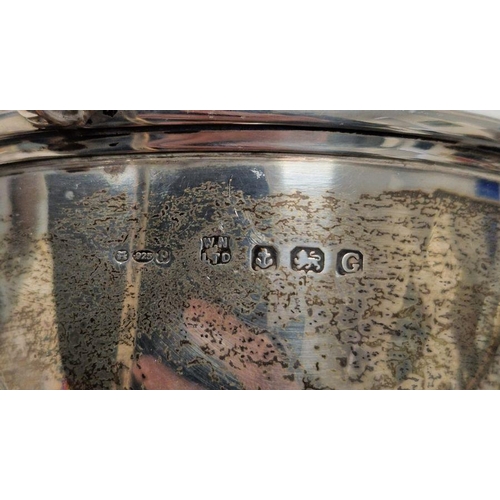 329 - Four early 20th century unengraved silver trophies, each being twin-handled and raised on pedestal, ... 
