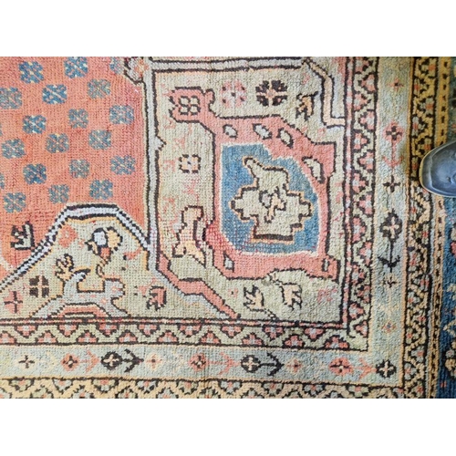 1033 - Large antique Heriz handmade wool pile carpet pink ground, with central hexagonal geometric medallio... 