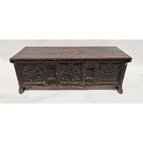 1048 - 17th century possibly Irish oak coffer having a carved panelled front and sides, 49cm high x 146cm w... 