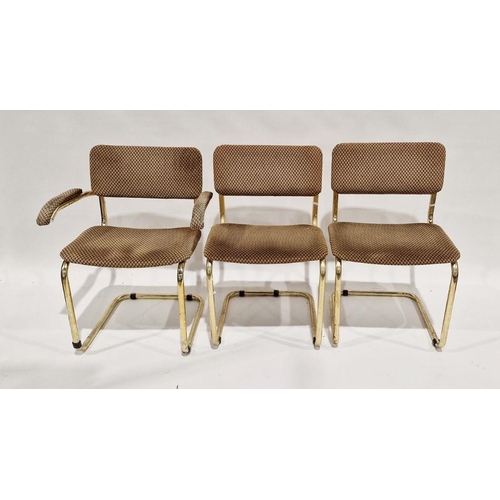 1067 - Set of three 20th century gilt metal tubular chairs, each with upholstered seat and back, one being ... 