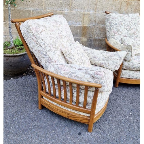 1209 - 20th century oak three-piece sofa suite by Ercol, design no.1154, comprising a three-seater sofa and... 