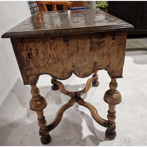 1243 - Late 17th/early 18th century walnut lowboy, the top having circular and quartered veneers with herri... 