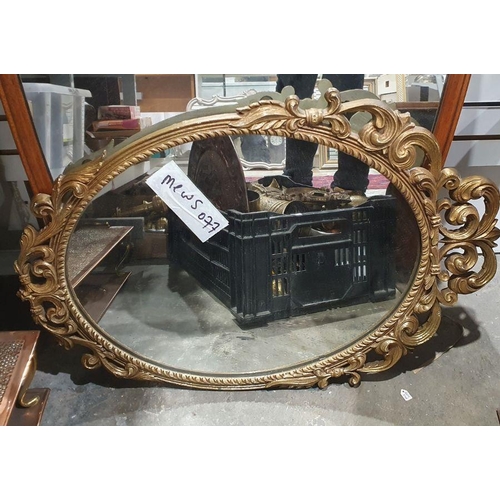 1254 - 20th century gilt framed wall mirror of oval form with carved and pierced scrolling decoration, 71cm... 