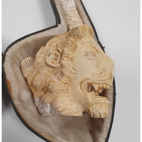 233 - Carved meerschaum giant pipe the bowl carved with lions head, stylised floral carving to the handle,... 