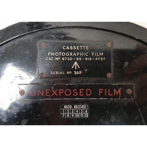 235 - Military photographic film cassette Cat. No. 6730-99-914-4797, serial number 309 with broad arrow ma... 