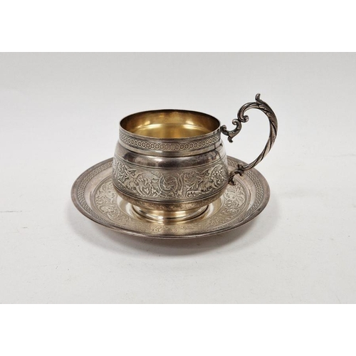 369D - 20th century French white metal cup and saucer, embossed phoenix and scrolling motifs throughout, th... 