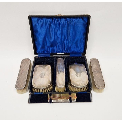 393 - Cased George V silver mounted vanity set, comprising three brushes and one comb, hallmarked Birmingh... 