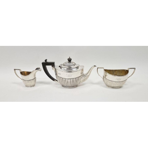 398 - Late Victorian three piece silver tea set, with half gadrooned decoration, comprising tea pot, two h... 