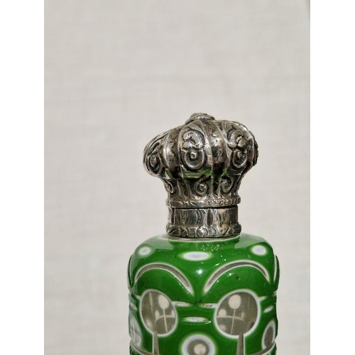 440 - Victorian green cased engraved glass scent bottle, with embossed white metal mount and original glas... 